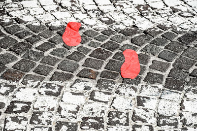 Red footprint on walkway