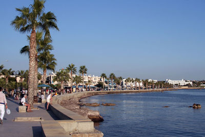 View of swimming pool by sea against sky