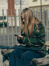 Young woman using mobile phone