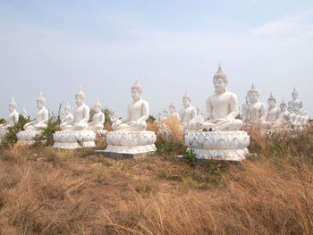Sculpture of buddha against sky