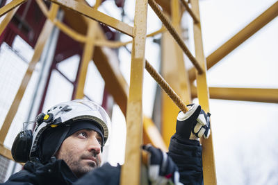 Engineer at building site looking away