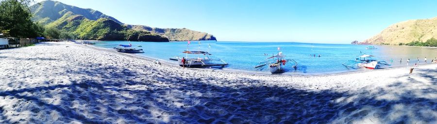 Scenic view of beach against clear sky