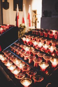 Close-up of illuminated candles in temple