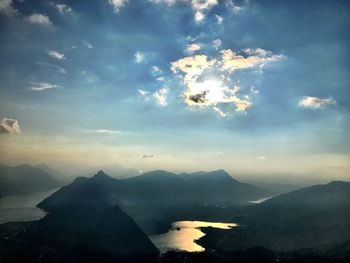 Scenic view of mountains against cloudy sky