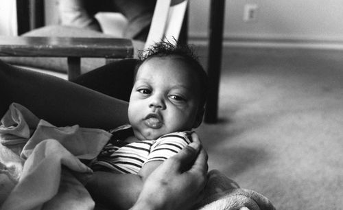 Close-up portrait of cute baby at home