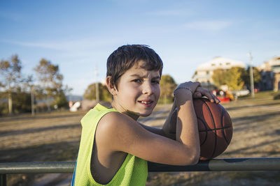 Portrait of boy against sky