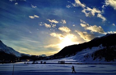 Scenic view of mountains against sky during winter