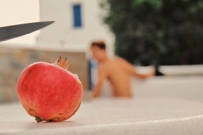 Close-up of boy with apple