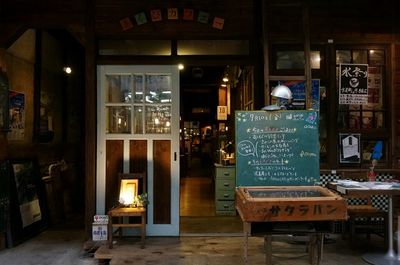 Close-up of illuminated text on wall at night