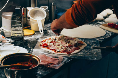 Close-up of man preparing food in kitchen