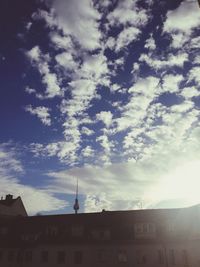 Low angle view of built structure against cloudy sky