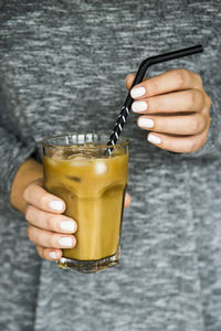 Close-up of hand holding drink