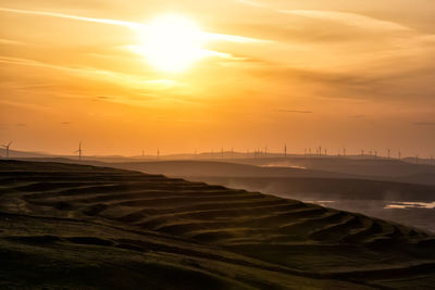 View of landscape against sky during sunset