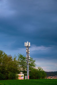 Tower on field against sky