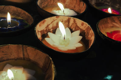 Close-up of illuminated tea light candles