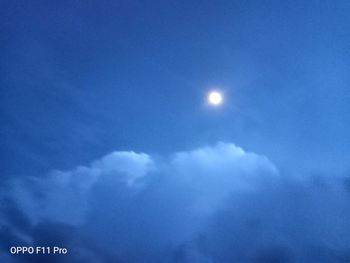 Low angle view of moon in sky at night
