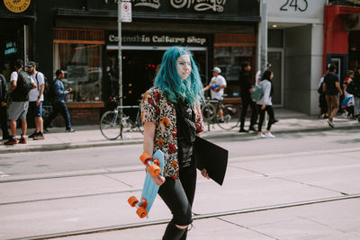 People walking on street in city