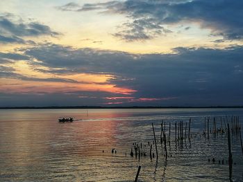 Scenic view of sea against sky at sunset