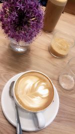 High angle view of cappuccino served on table