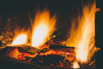 Close-up of fire burning at night