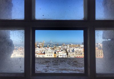 Buildings seen through window