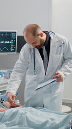 Doctor examining patient at clinic