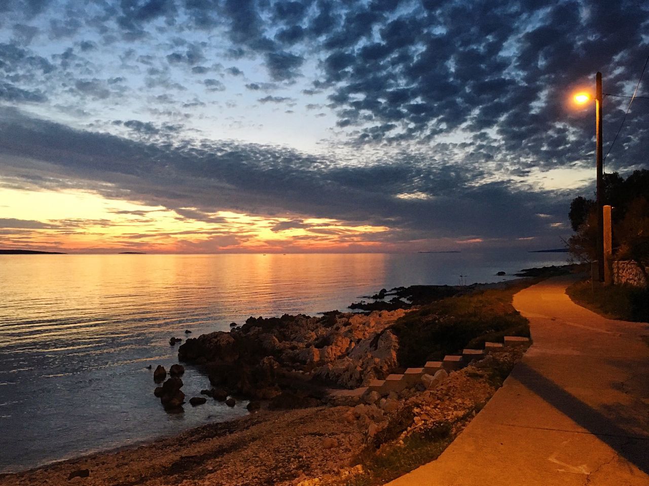 sea, sunset, water, nature, sky, beauty in nature, scenics, horizon over water, beach, rock - object, no people, tranquil scene, sun, tranquility, cloud - sky, outdoors