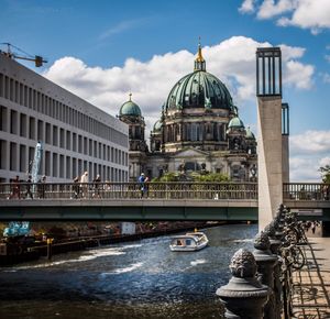 Statue of cathedral against cloudy sky