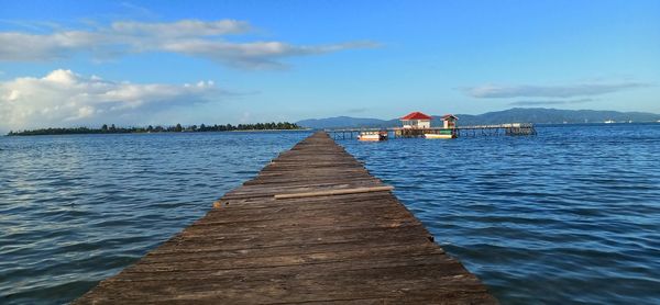 Pier over sea against sky