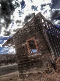 Low angle view of built structure against cloudy sky