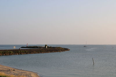 Scenic view of sea against clear sky