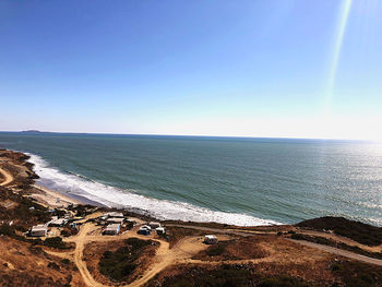 Scenic view of sea against clear blue sky