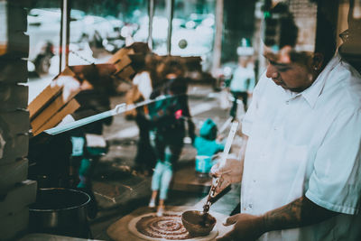 People working in kitchen