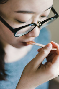 Close-up of young woman having food