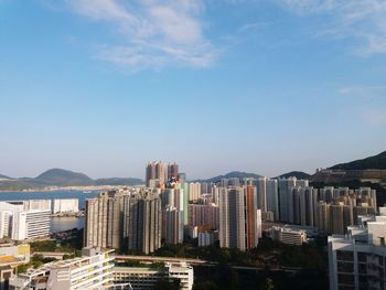 Modern buildings in city against sky