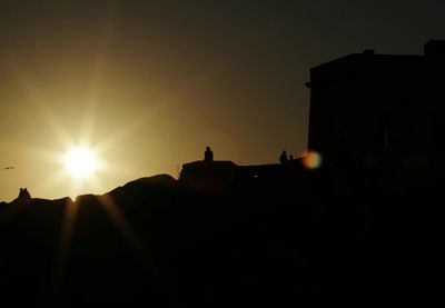 Silhouette of building at sunset