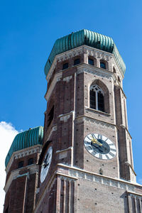 Low angle view of old building against blue sky