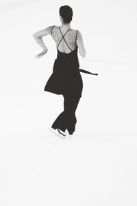 Woman looking away over white background