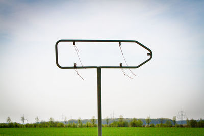 Low angle view of field against clear sky