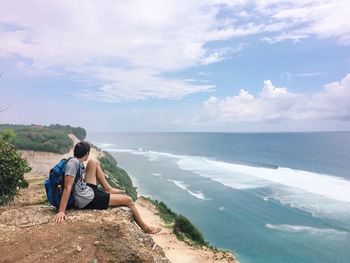 Scenic view of sea against cloudy sky