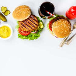 Close-up of burgers on serving board