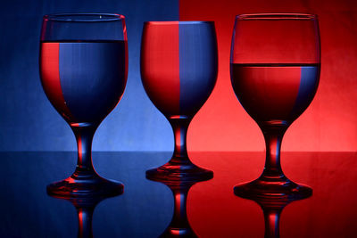 Close-up of wine glasses on table