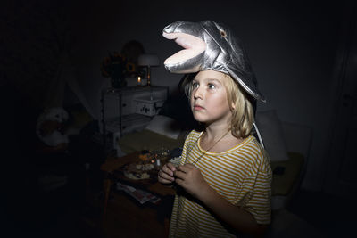 Boy wearing dolphin headdress