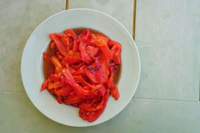 High angle view of chopped tomatoes in bowl on table