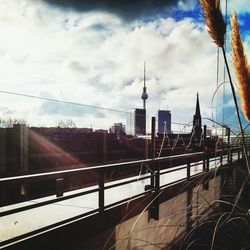 City skyline against cloudy sky