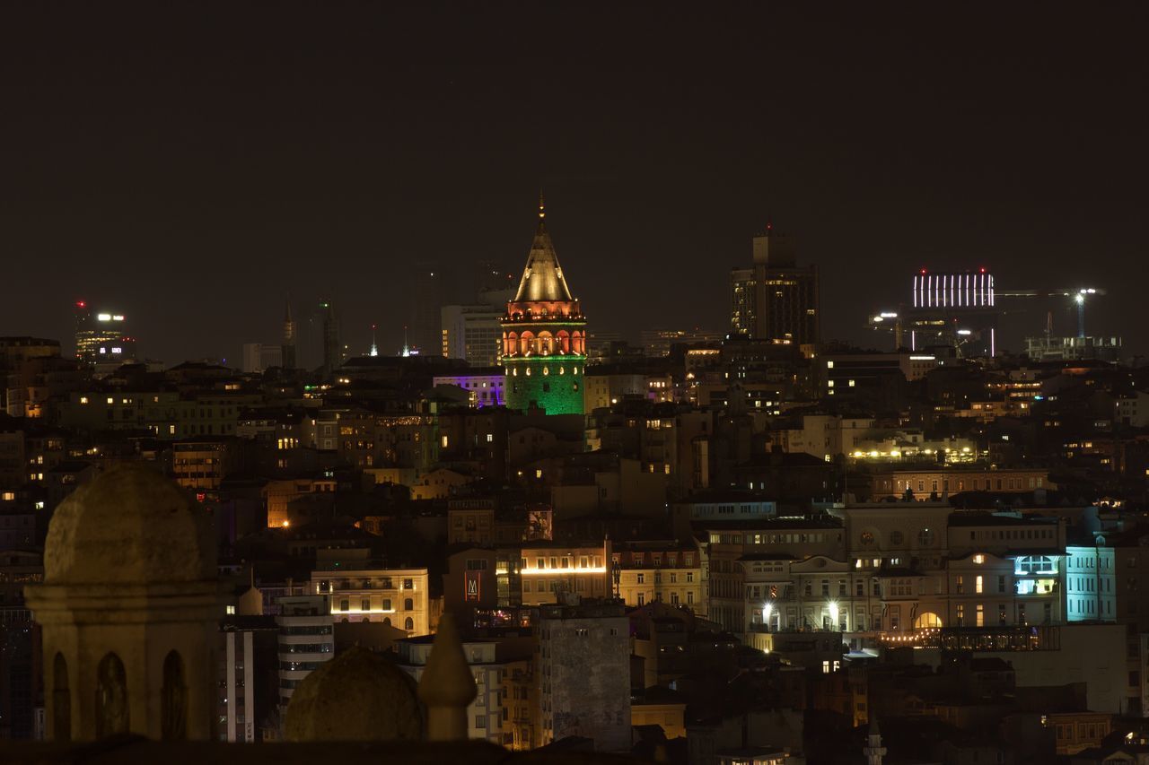 ILLUMINATED BUILDINGS AT NIGHT