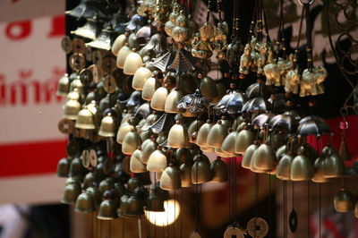 Close-up of decorations hanging in store for sale