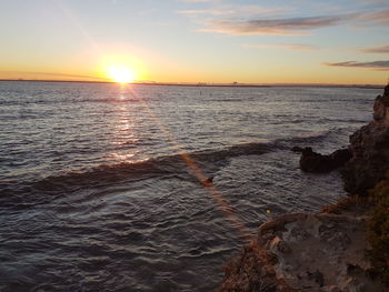 Scenic view of sea against sky during sunset