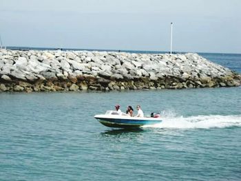 People on boat in sea