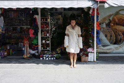 Portrait of woman standing at market